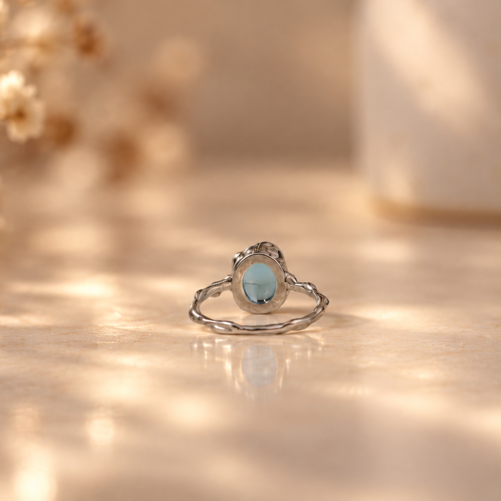 Handmade organic sterling silver ring with a light blue topaz oval cabochon, Rooz Jewellery Toronto