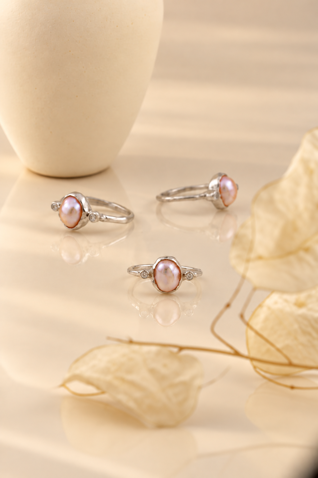 Organic sterling silver ring with a lustrous pearl and small lab-grown diamonds, handmade by Rooz Jewellery in Toronto