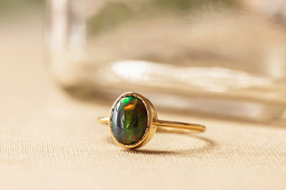 Natural Cabochon Oval Black Ethiopian Opal in 10k Solid Gold Ring