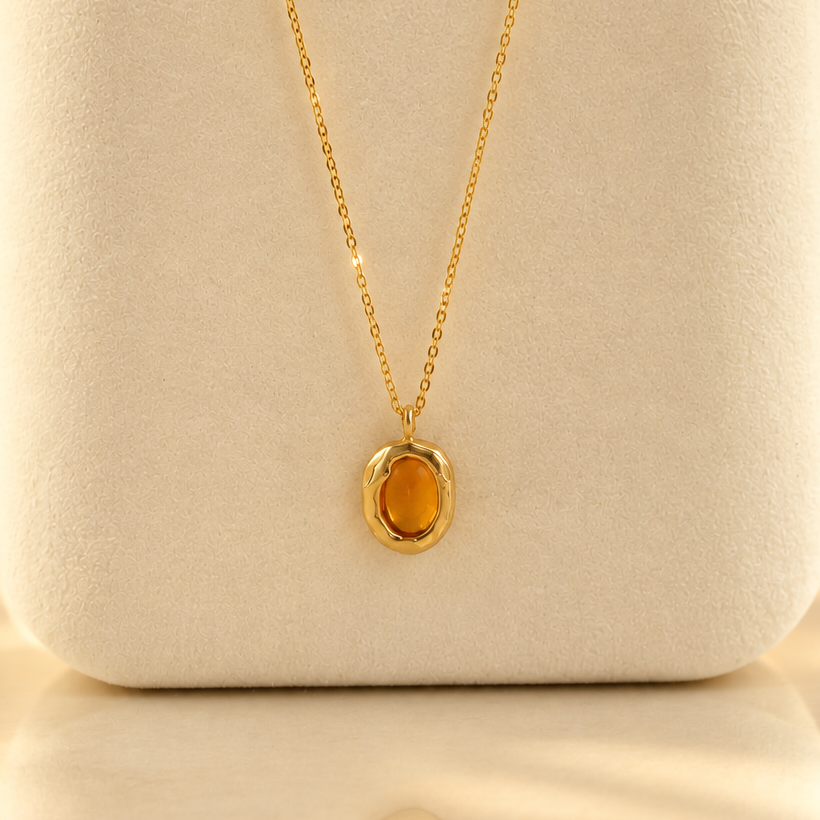 Handmade organic solid 10k gold pendant with a yellow oval citrine cabochon on a gold chain, Rooz Jewellery Toronto
