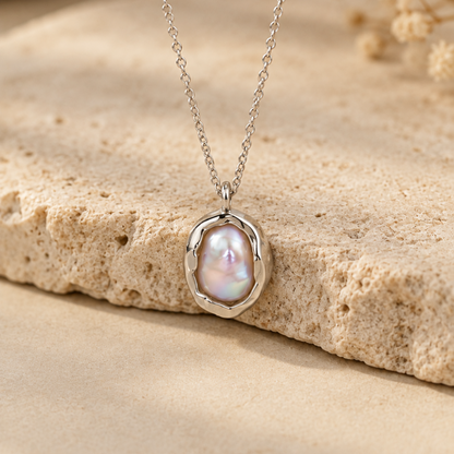 Organic sterling silver pendant with a natural irregular freshwater pearl, handmade by Rooz Jewellery in Toronto