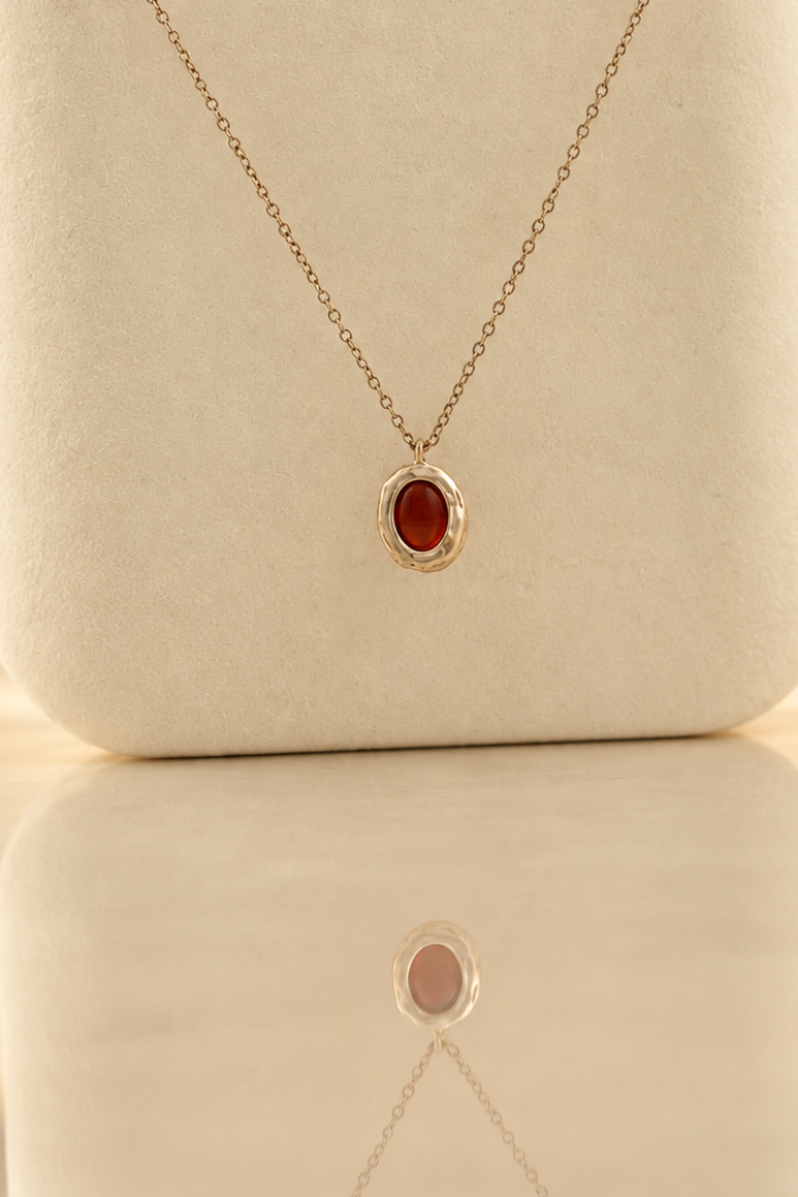 Handmade organic sterling silver pendant with a wine-red oval garnet cabochon, Rooz Jewellery Toronto