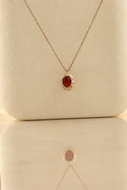 Handmade organic sterling silver pendant with a wine-red oval garnet cabochon, Rooz Jewellery Toronto