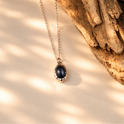 Handmade organic sterling silver pendant with a black onyx oval cabochon on a silver chain, Rooz Jewellery