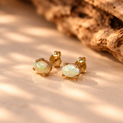 Pair of handmade stud earrings with white oval Australian opals in solid 10k yellow gold, Rooz Jewellery Toronto