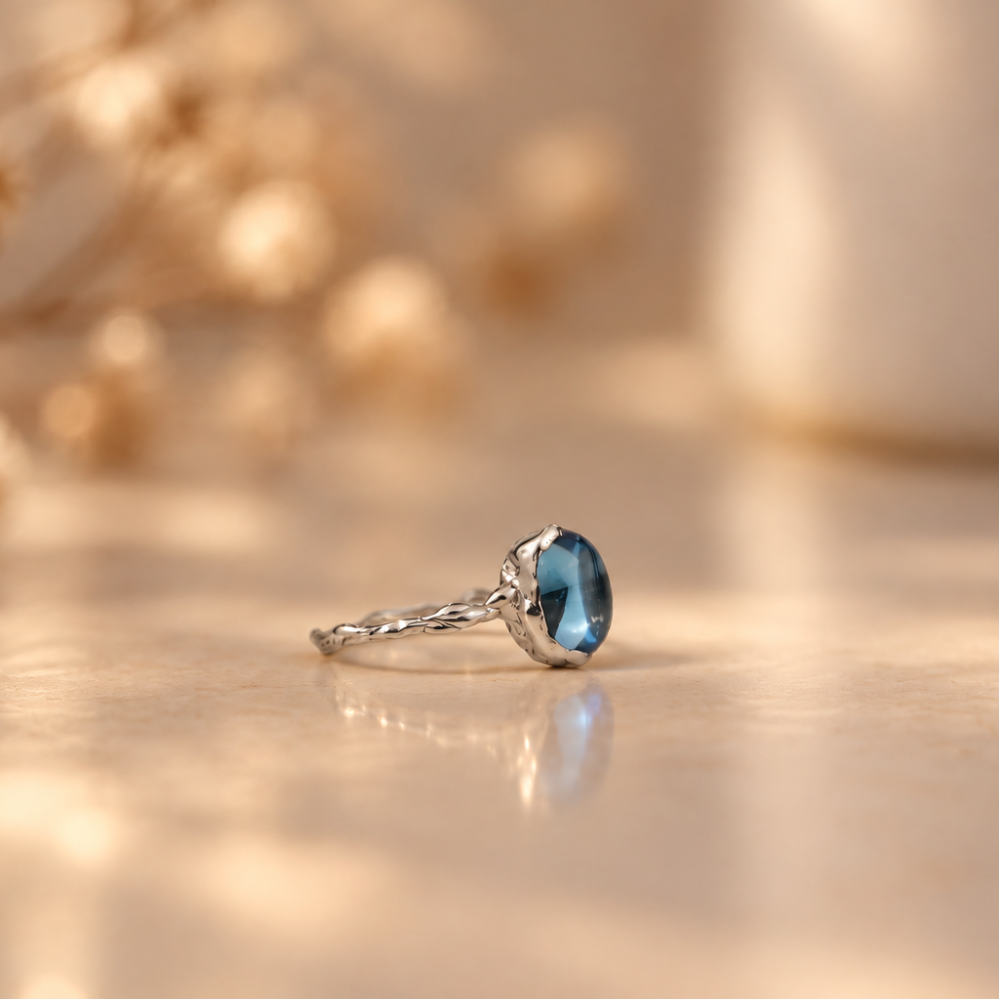 Handmade organic sterling silver ring with a light blue topaz oval cabochon, Rooz Jewellery Toronto