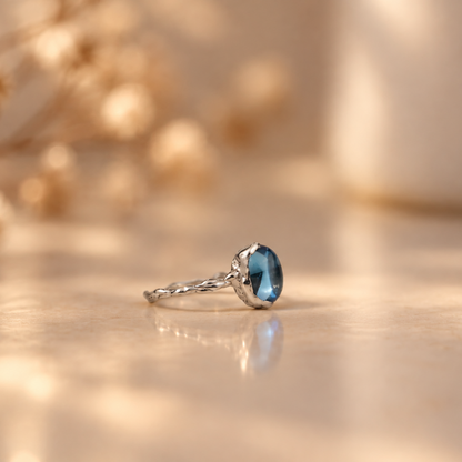 Handmade organic sterling silver ring with a light blue topaz oval cabochon, Rooz Jewellery Toronto