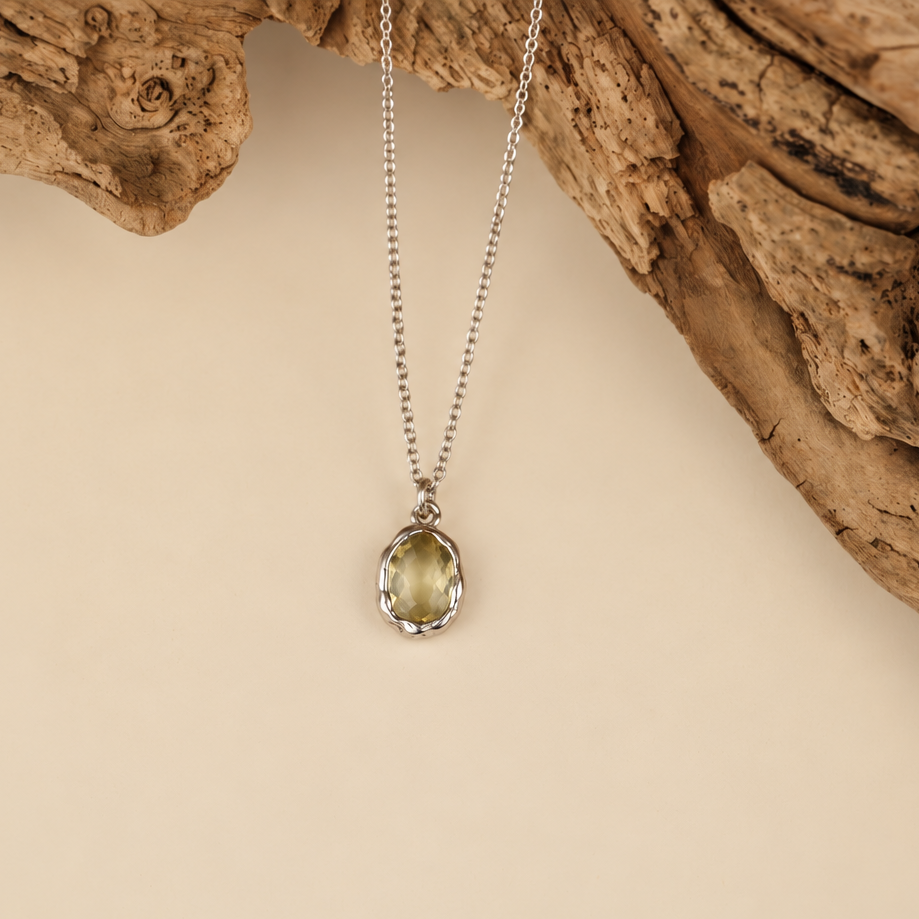 Handmade organic sterling silver pendant with a pale yellow oval faceted citrine on a silver chain, Rooz Jewellery Toronto