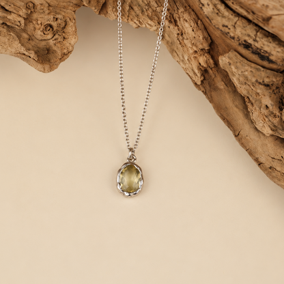 Handmade organic sterling silver pendant with a pale yellow oval faceted citrine on a silver chain, Rooz Jewellery Toronto