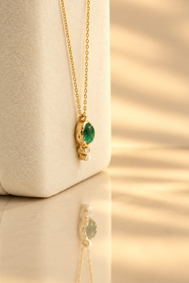 Organic solid 10k gold pendant with a green emerald cabochon and three small lab-grown diamonds, Rooz Jewellery Toronto