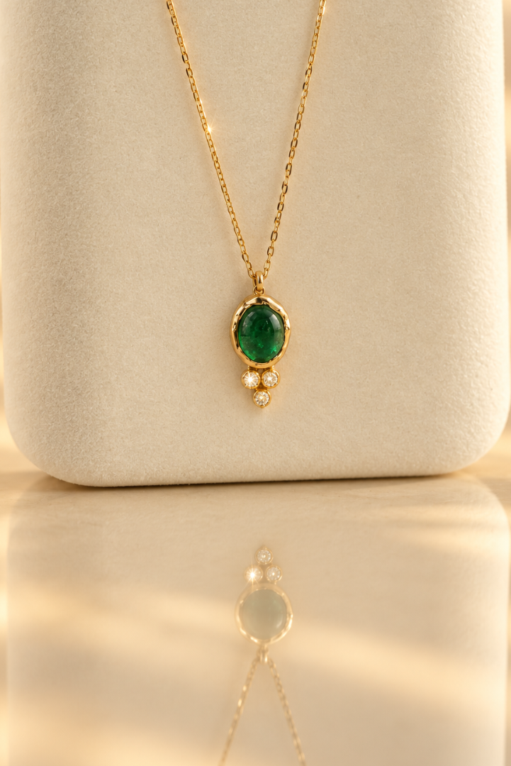 Organic solid 10k gold pendant with a green emerald cabochon and three small lab-grown diamonds, Rooz Jewellery Toronto