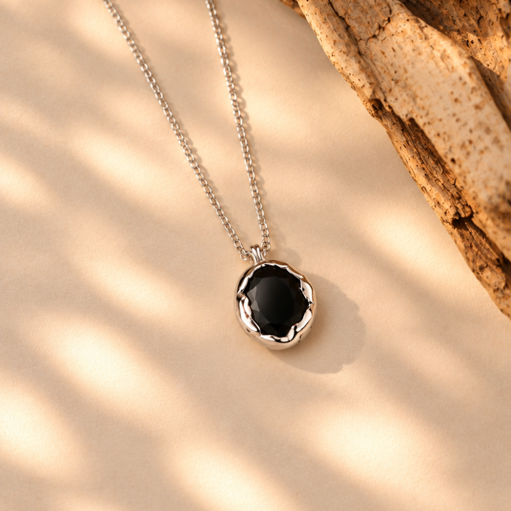 Handmade organic sterling silver pendant with a black oval faceted onyx on a silver chain, Rooz Jewellery Toronto