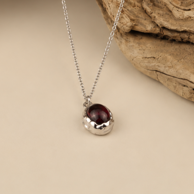 Handmade organic sterling silver pendant with a wine-red oval garnet cabochon, Rooz Jewellery Toronto
