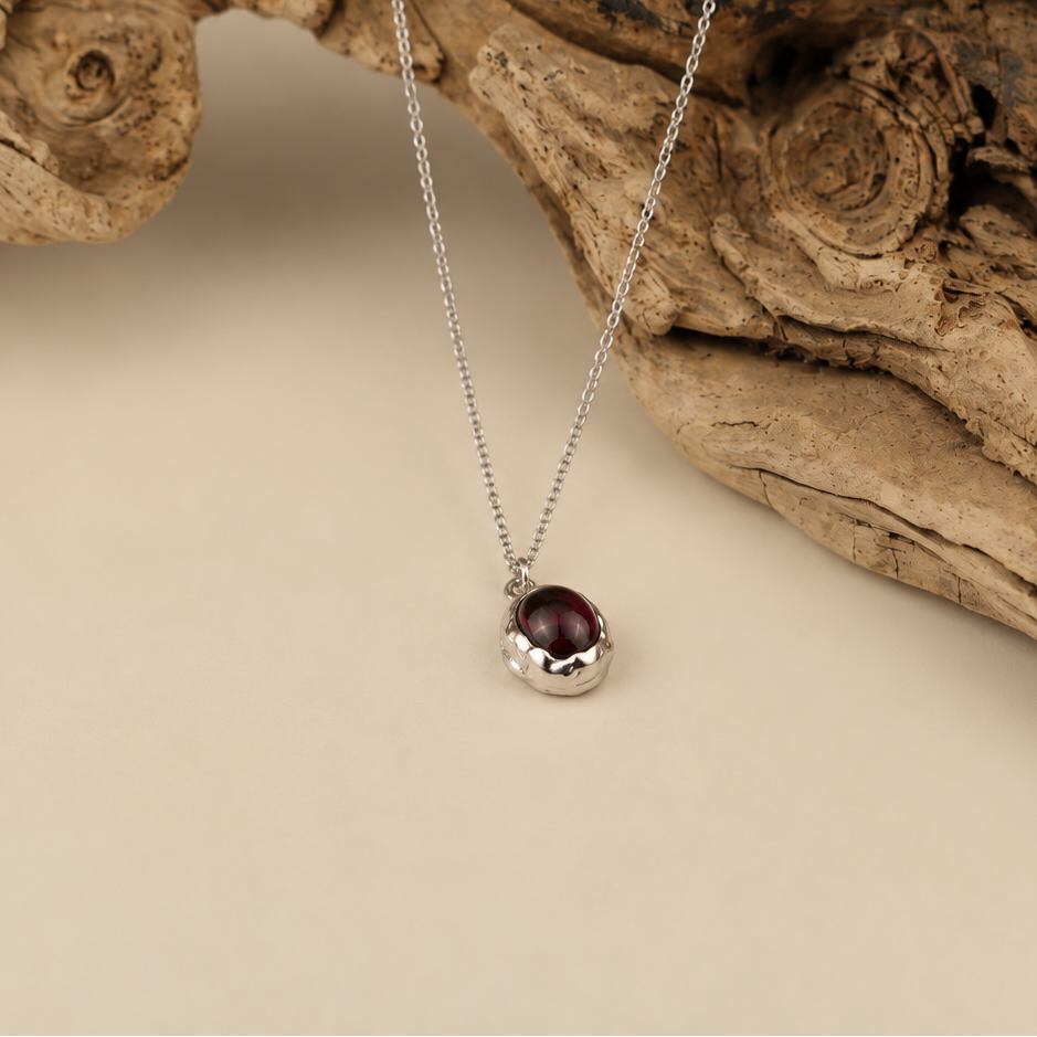 Handmade organic sterling silver pendant with a wine-red oval garnet cabochon, Rooz Jewellery Toronto