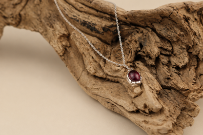 Handmade organic sterling silver pendant with a wine-red oval garnet cabochon, Rooz Jewellery Toronto