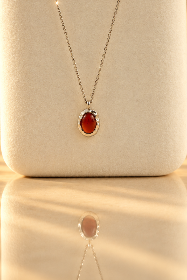 Handmade organic sterling silver pendant with a wine-red oval garnet cabochon, Rooz Jewellery Toronto