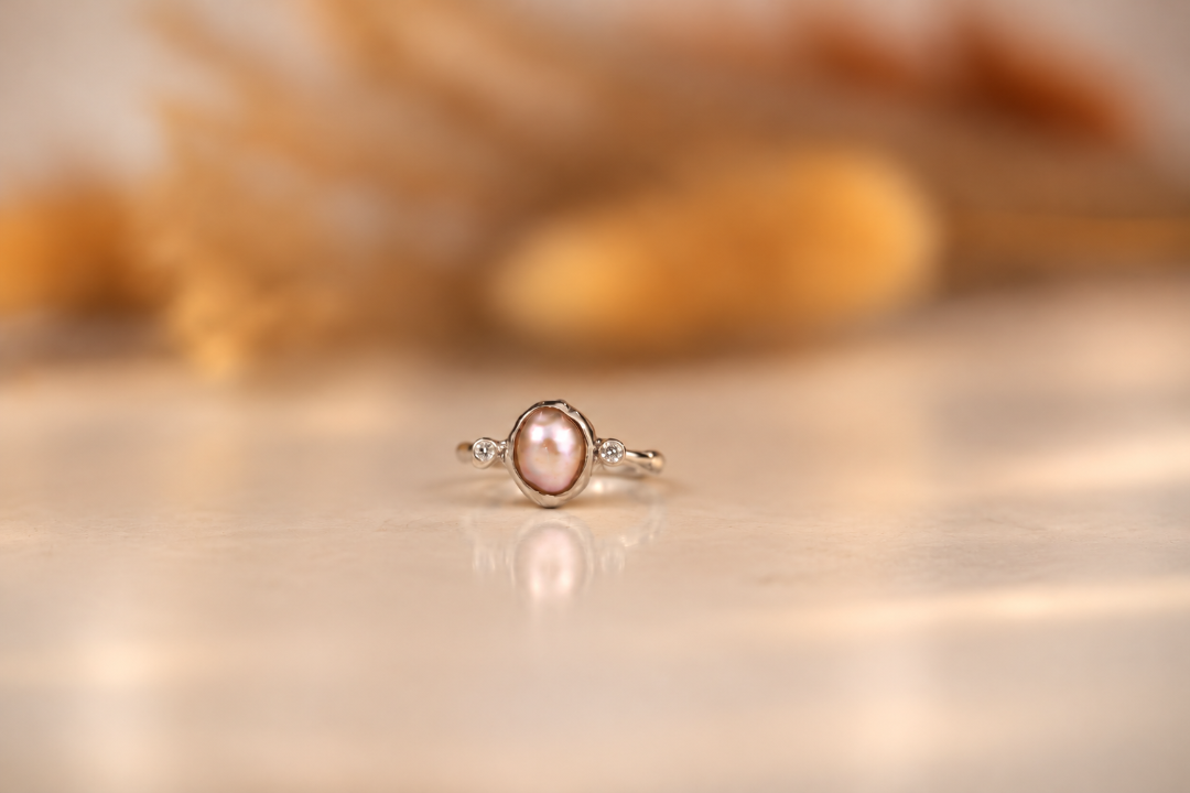 Organic sterling silver ring with a lustrous pearl and small lab-grown diamonds, handmade by Rooz Jewellery in Toronto