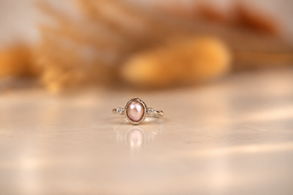 Organic sterling silver ring with a lustrous pearl and small lab-grown diamonds, handmade by Rooz Jewellery in Toronto