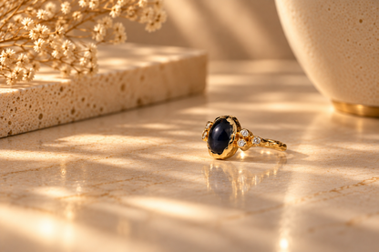 Organic 10k yellow gold ring with a blue sapphire and six small lab-grown diamonds, handmade by Rooz Jewellery