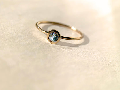 Round Aquamarine Bezel-Set Gold Ring