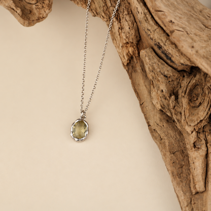 Handmade organic sterling silver pendant with a pale yellow oval faceted citrine on a silver chain, Rooz Jewellery Toronto