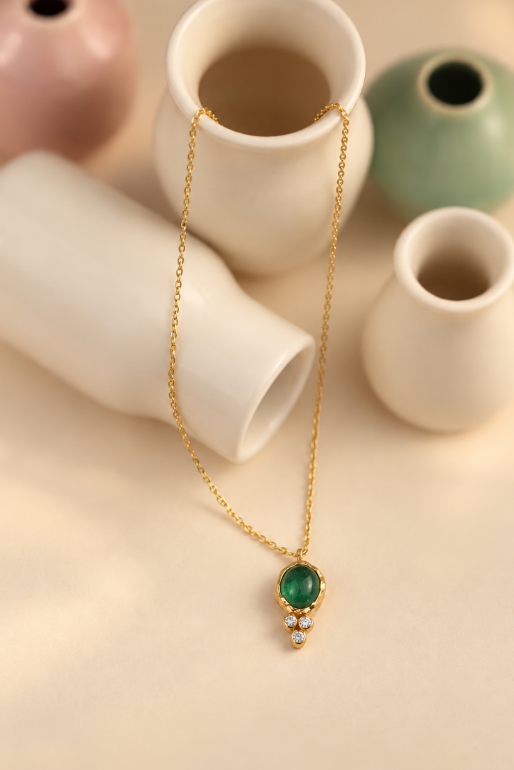 Organic solid 10k gold pendant with a green emerald cabochon and three small lab-grown diamonds, Rooz Jewellery Toronto
