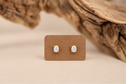 Pair of handmade stud earrings with white oval Australian opals in solid 10k yellow gold, Rooz Jewellery Toronto