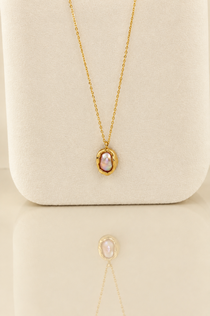 Organic solid 10k gold pendant with an irregular natural freshwater pearl on a gold chain, handmade by Rooz Jewellery