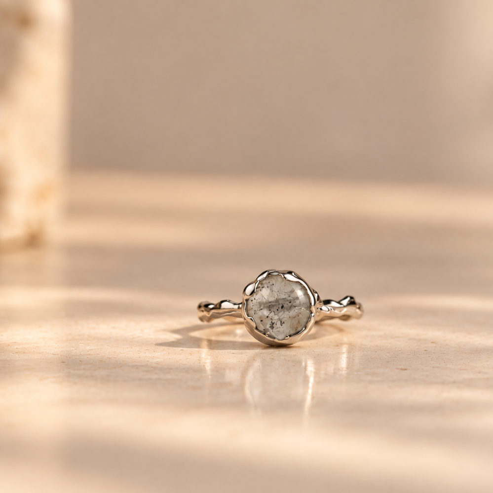 Organic sterling silver ring with a pale blue oval aquamarine cabochon, handmade by Rooz Jewellery in Toronto