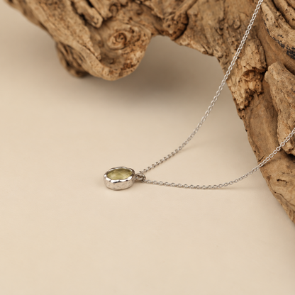 Handmade organic sterling silver pendant with a pale yellow oval faceted citrine on a silver chain, Rooz Jewellery Toronto