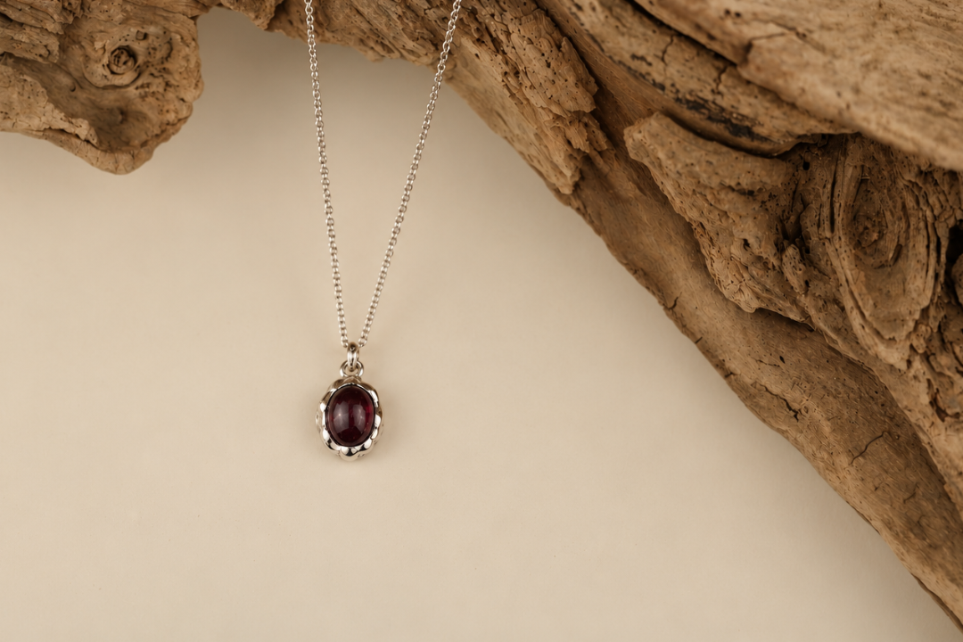 Handmade organic sterling silver pendant with a wine-red oval garnet cabochon, Rooz Jewellery Toronto