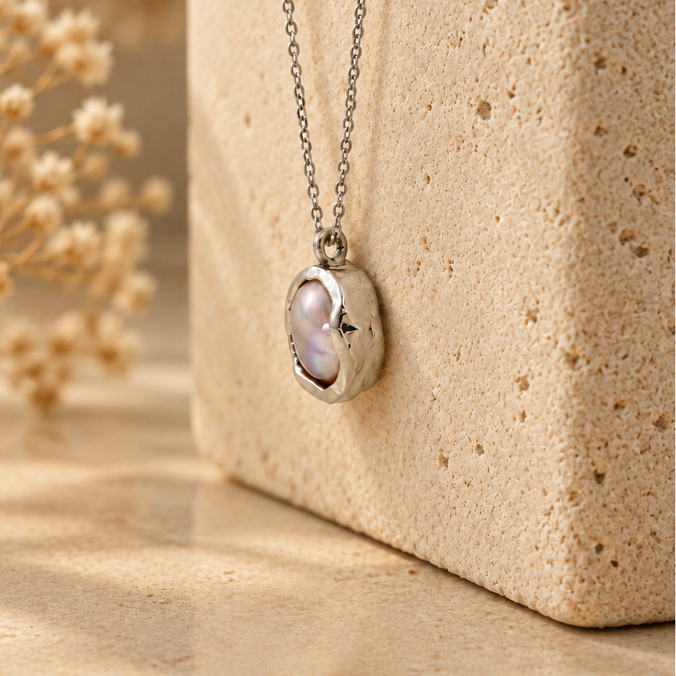 Organic sterling silver pendant with a natural irregular freshwater pearl, handmade by Rooz Jewellery in Toronto