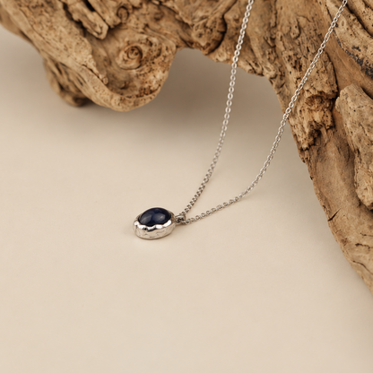 Handmade organic sterling silver pendant with a black onyx oval cabochon on a silver chain, Rooz Jewellery
