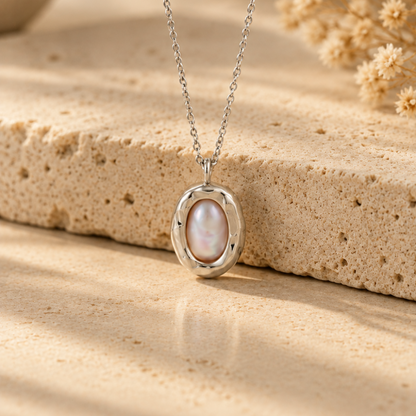 Organic sterling silver pendant with a natural irregular freshwater pearl, handmade by Rooz Jewellery in Toronto