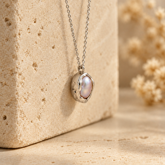 Organic sterling silver pendant with a natural irregular freshwater pearl, handmade by Rooz Jewellery in Toronto