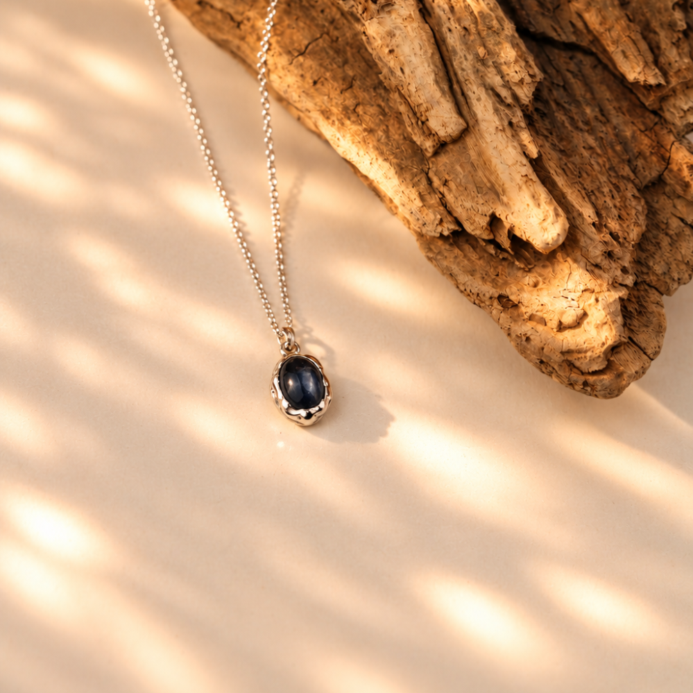 Handmade organic sterling silver pendant with a black onyx oval cabochon on a silver chain, Rooz Jewellery