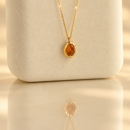 Handmade organic solid 10k gold pendant with a yellow oval citrine cabochon on a gold chain, Rooz Jewellery Toronto