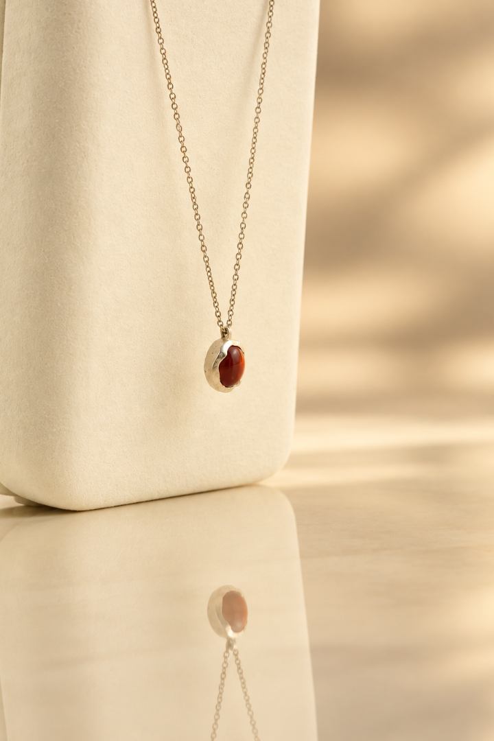 Handmade organic sterling silver pendant with a wine-red oval garnet cabochon, Rooz Jewellery Toronto