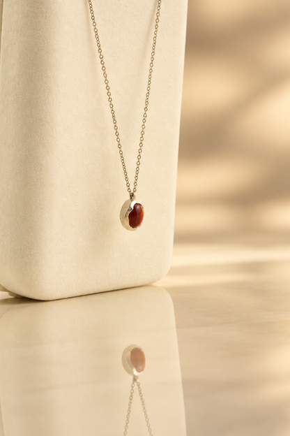 Handmade organic sterling silver pendant with a wine-red oval garnet cabochon, Rooz Jewellery Toronto