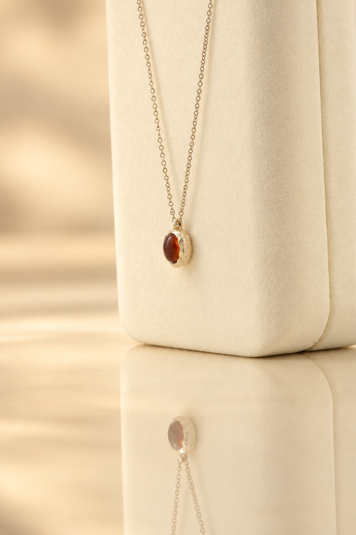 Handmade organic sterling silver pendant with a wine-red oval garnet cabochon, Rooz Jewellery Toronto