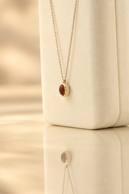 Handmade organic sterling silver pendant with a wine-red oval garnet cabochon, Rooz Jewellery Toronto
