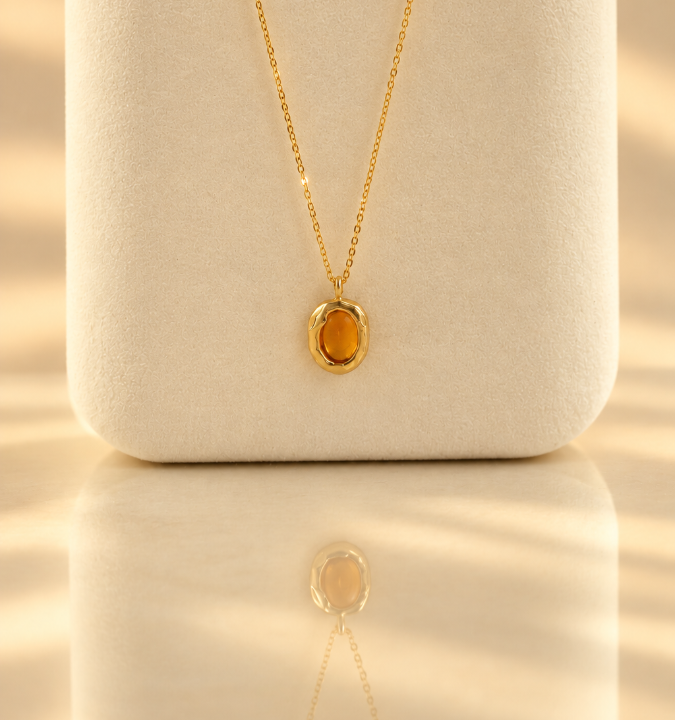 Handmade organic solid 10k gold pendant with a yellow oval citrine cabochon on a gold chain, Rooz Jewellery Toronto
