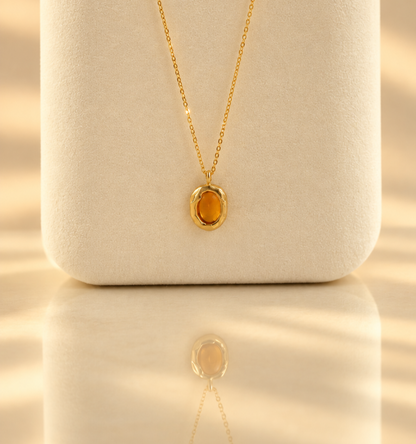 Handmade organic solid 10k gold pendant with a yellow oval citrine cabochon on a gold chain, Rooz Jewellery Toronto
