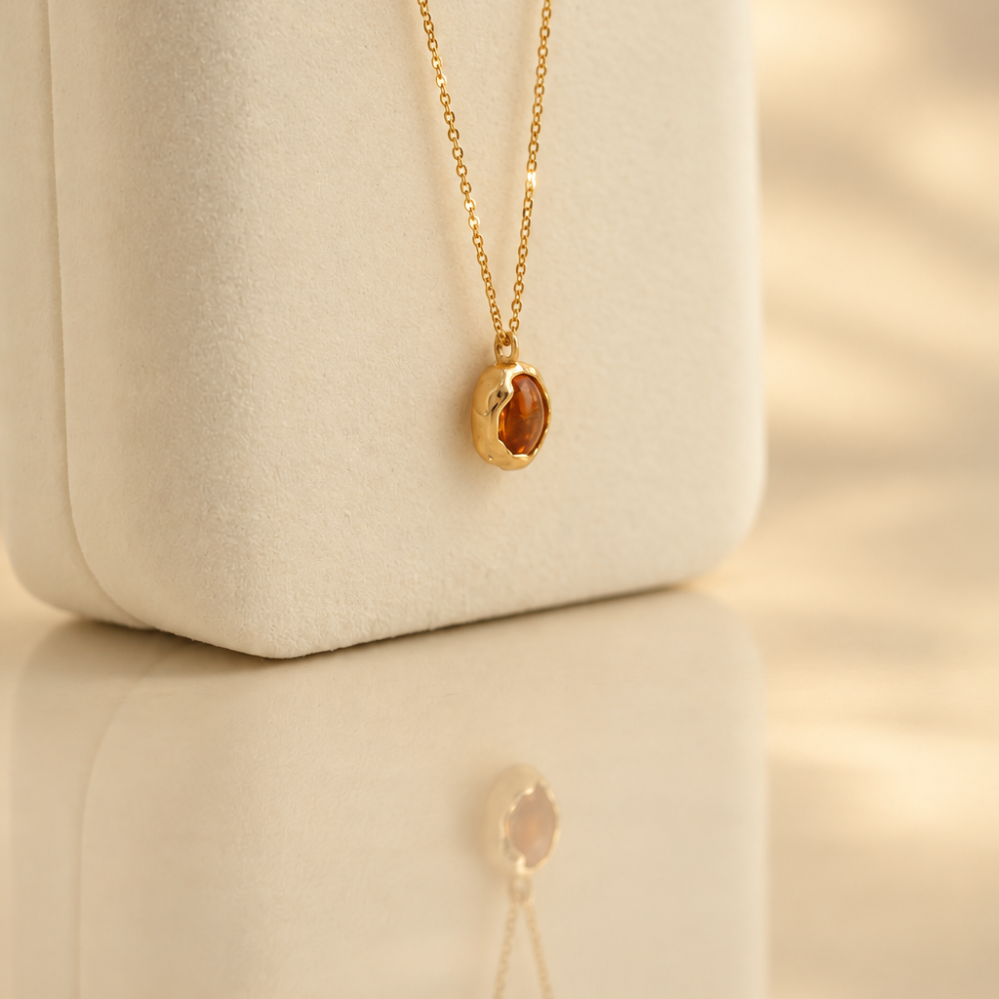 Handmade organic solid 10k gold pendant with a yellow oval citrine cabochon on a gold chain, Rooz Jewellery Toronto